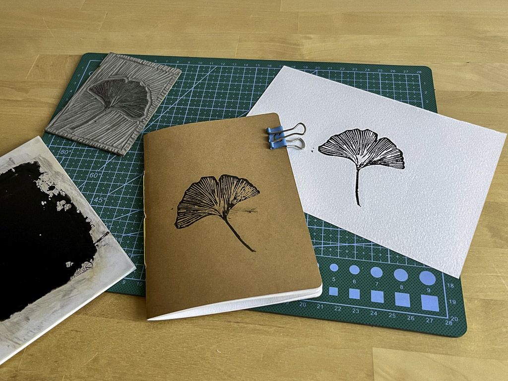 Notebook and paper printed with lino block